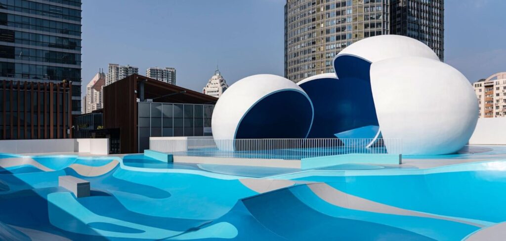 Aerial view of the Qingdao Mixc renovation showcasing the sky-high skatepark integrated into the urban landscape