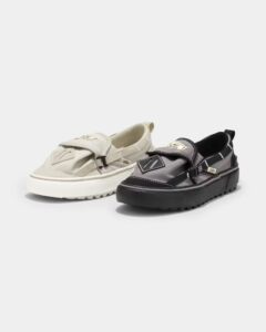 A pair of Nicole McLaughlin x Vans Slip-ons featuring multiple pockets and sustainable materials for a functional design