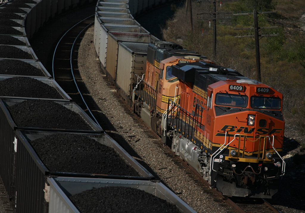 A freight train carrying Nike sneakers moving through the desert, highlighting vulnerabilities in cargo transport security