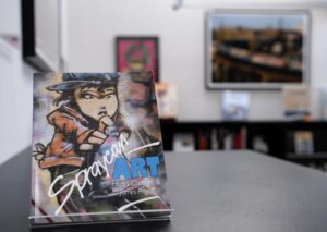 Cover of Spraycan Art featuring vibrant graffiti designs, showcasing the evolution of street art and its cultural significance