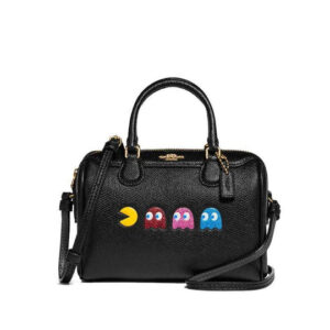 A Coach Micro Bennett Satchel featuring Pac-Man and colorful ghost animations, combining retro gaming nostalgia with haute fashion