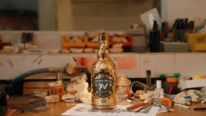 Chivas Regal XV Gold Caged Edition bottle, elegantly encased in a 14-karat gold cage, designed by Dolly Cohen for collectors