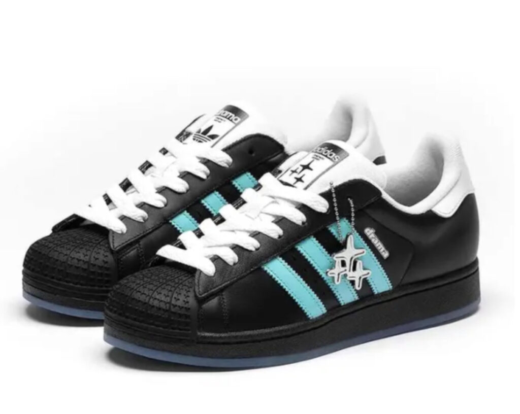 Drama Call x Adidas Superstar II limited edition shoe, showcasing a stylish aqua blue colorway inspired by Manchester's Metrolink network