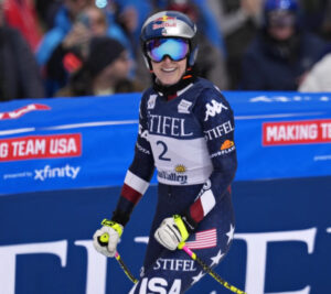 Lindsey Vonn competing in a World Cup race, showcasing her exceptional skiing skills as she prepares for the 2026 Olympics in Cortina