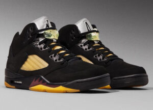 A Ma Maniére X Air Jordan 5 “Dusk” merge shoe, showcasing its premium materials and unique colorway