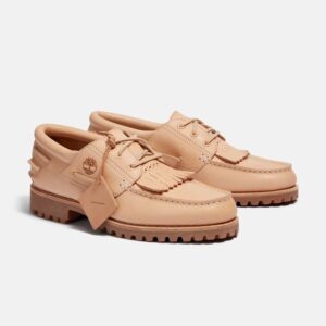 Close-up of the Hender Scheme x Timberland Boat Shoe showcasing vegetable-tanned leather and embossed leather eyelets
