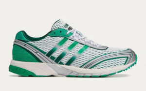 Sporty & Rich x adidas Adizero Adios 1 sneaker in cream colorway displayed on minimalist background