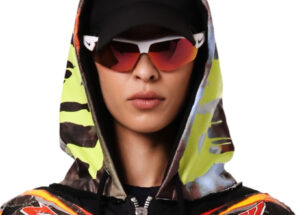 Vetements Navy Racing Bomber Jacket with embroidered patches, oversized fit, and coated hood, styled on male model