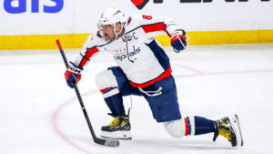 Alexander Ovechkin celebrates on ice after scoring his 895th NHL goal, breaking Wayne Gretzky’s all-time record