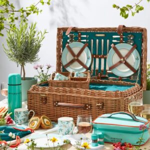 Fortnum’s Camellia Picnic Hamper for Four featuring porcelain tableware, glasses, and cutlery in a classic wicker basket