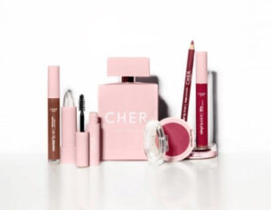 Dieciocho Beauty product display featuring lipsticks, eyeshadows, and skincare items in soft pink and neutral tones