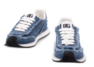 Dolce & Gabbana Cushion shoe in blue and white with a sculpted sole and layered materials, displayed on minimalist set