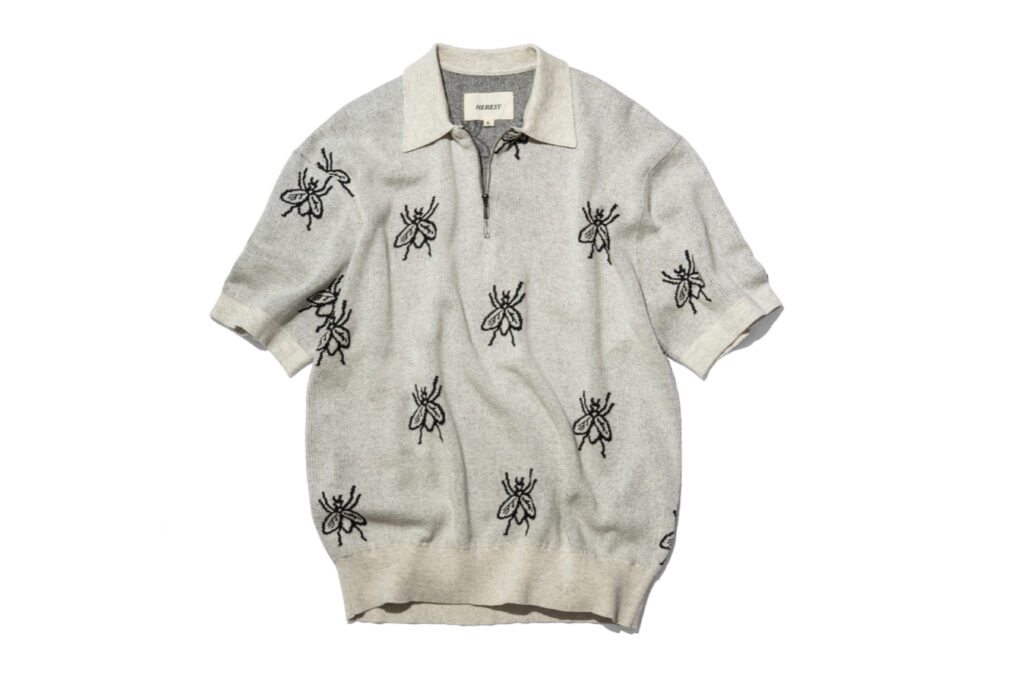 HERESY Fly Knit short-sleeve shirt featuring jacquard fly pattern, half-zip front, and boxy summer fit
