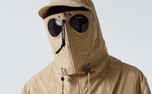 C.P. Company 2025 goggle jacket in Chrome-R fabric with watch lens detail and ergonomic cut, modeled on urban street