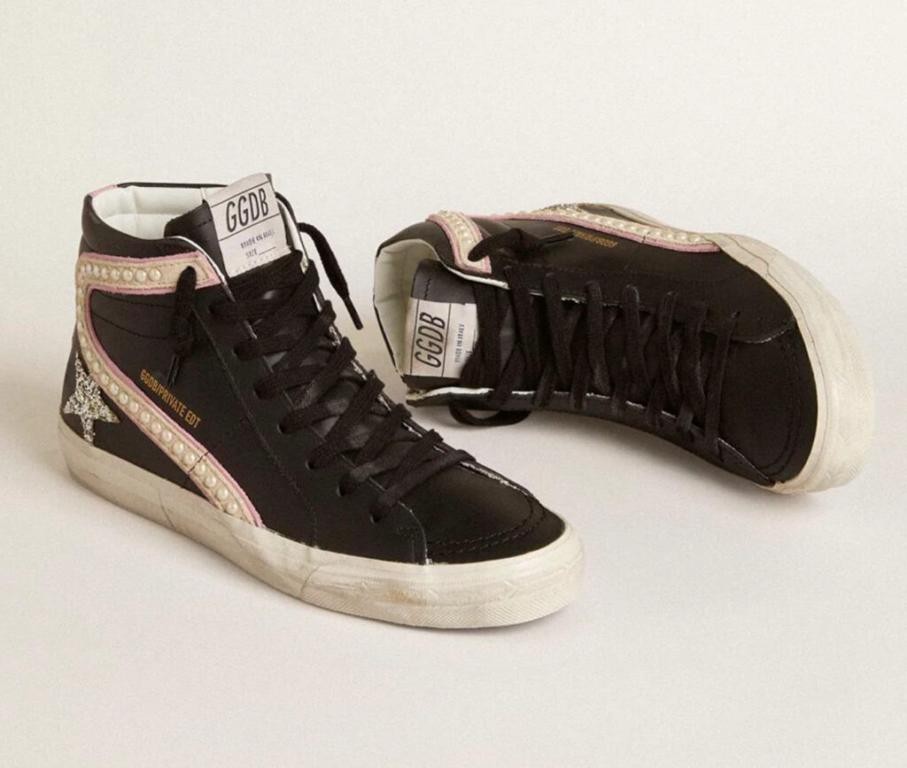 Slide LTD high-top shoe featuring a platinum glitter star, suede flash detailing, and pearl embellishments