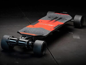 The Mach One electric skateboard by Radium Performance, shown in carbon-black with dual motors and swing-arm suspension