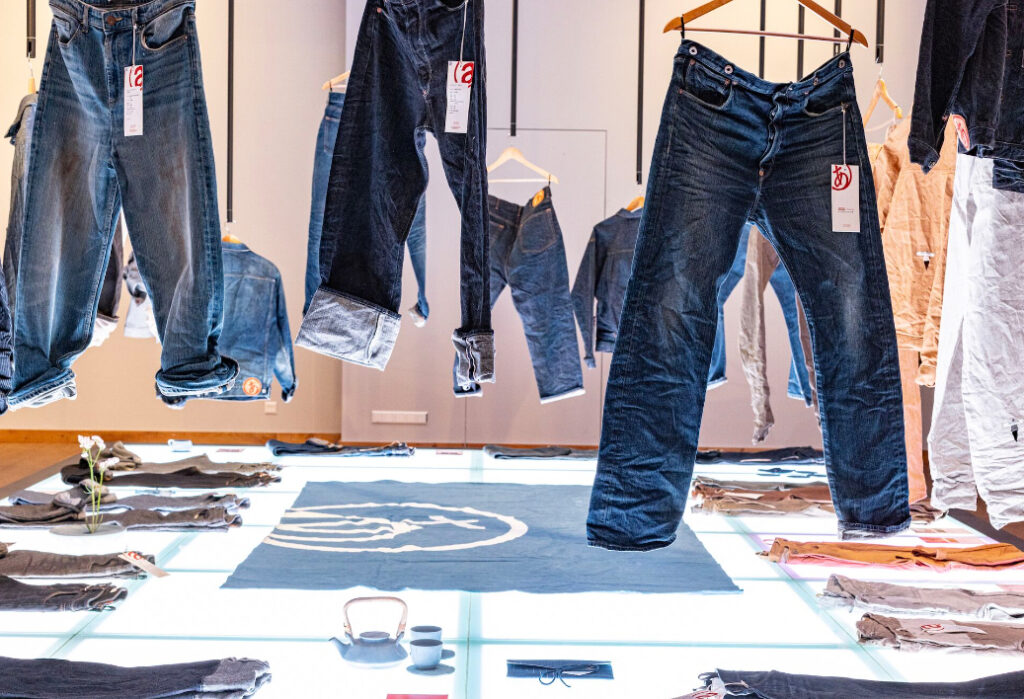 Indigo-hued Japanese-designed denim jacket from Arvind Limited displayed at Fashion for Good HQ during exclusive preview