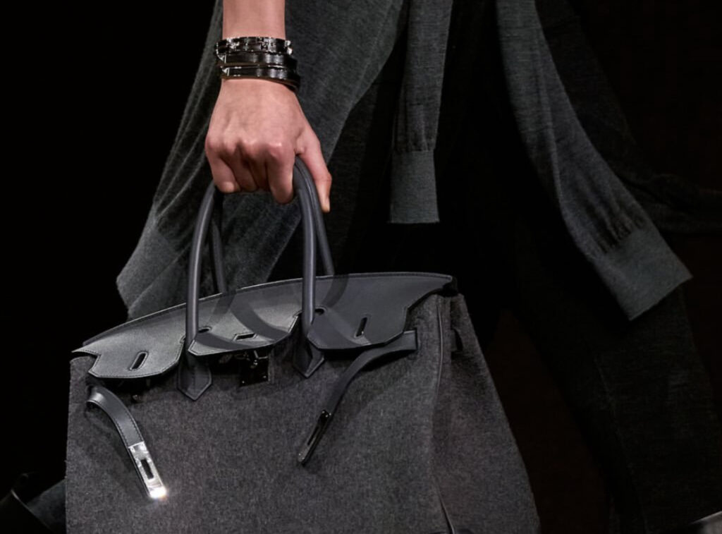 Hermès flagship storefront in Paris reflecting strong investor confidence amid luxury stock shifts
