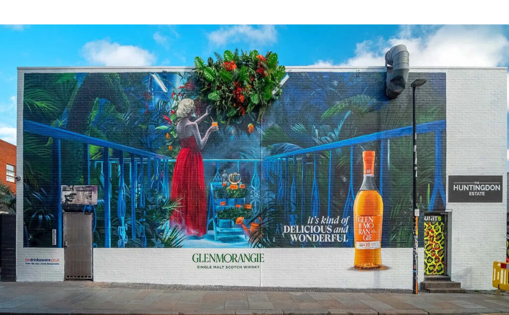 Glenmorangie’s East London billboard adorned with lifelike 3D foliage, showcasing the “It’s Kind of Delicious and Wonderful” campaign