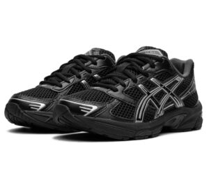 ASICS GEL-1130 Black/Pure Silver shoes on concrete with dramatic lighting