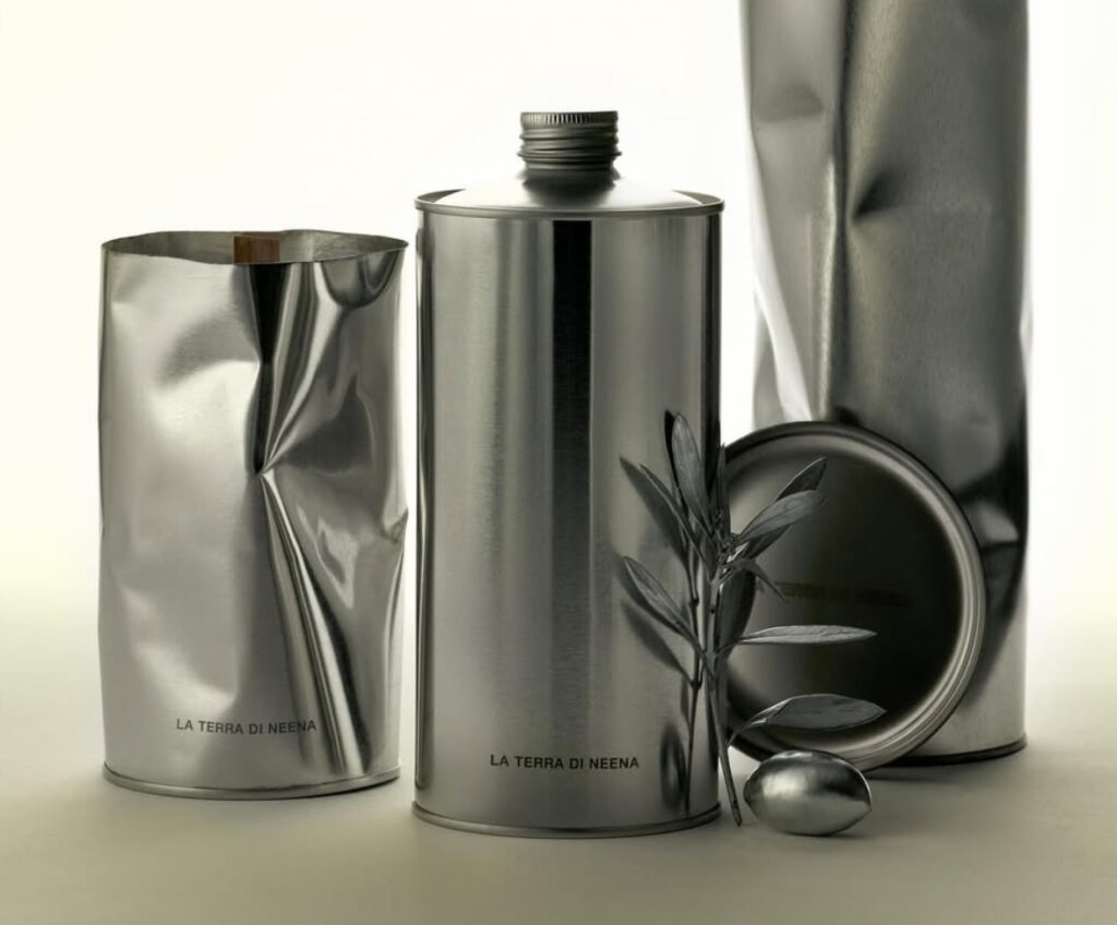 Glass bottle of La Terra di Neena olive oil by Crosby Studios on minimalist concrete countertop