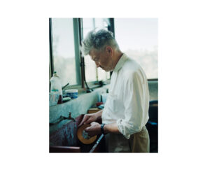 David Lynch in his Los Angeles studio, meditating amid abstract paintings and oxygen tubes, 2025
