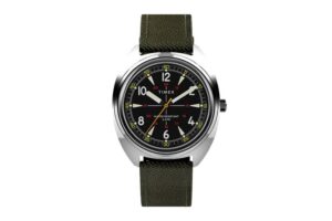 Timex x Bespoke Post Field Watch featuring a 36mm stainless steel case, black dial, and olive Cordura fabric strap