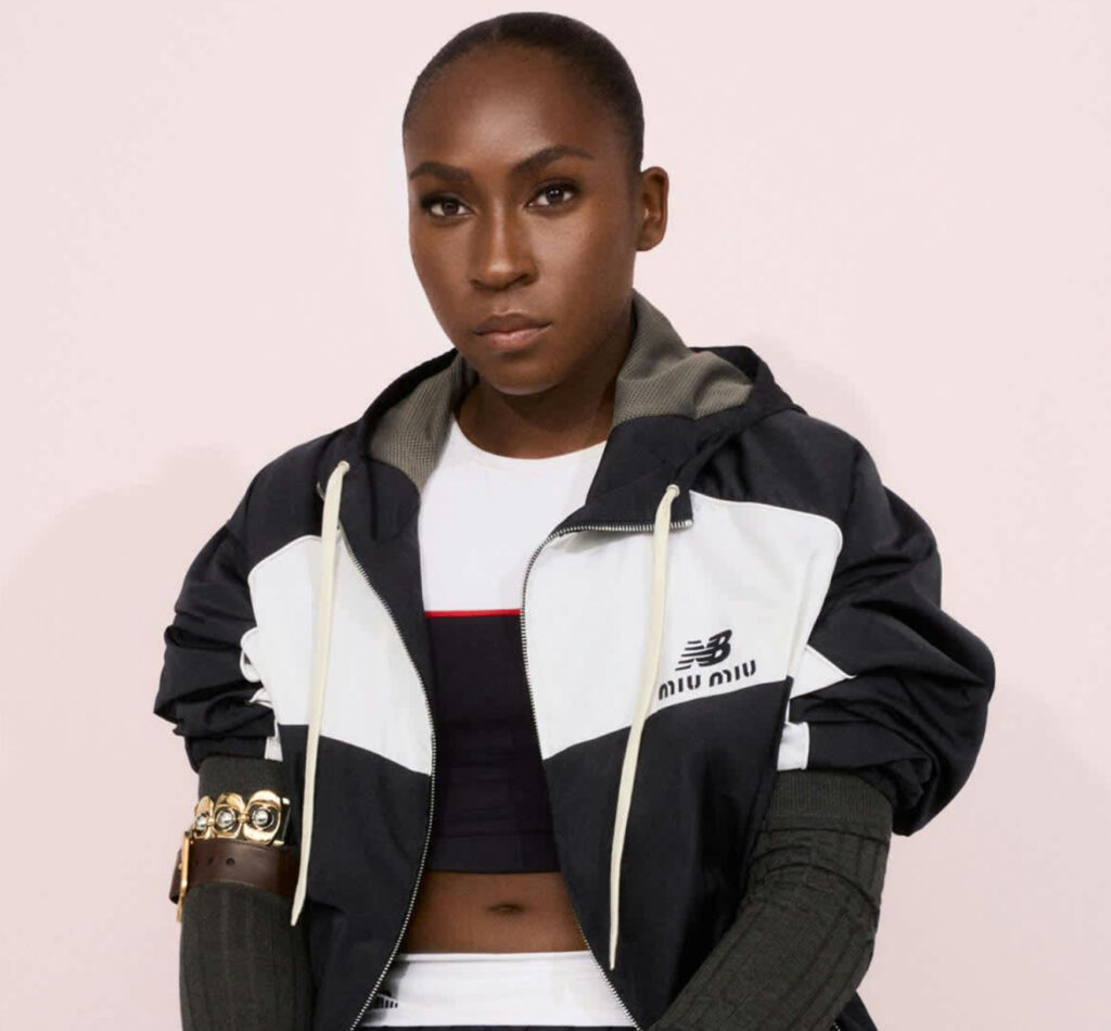 Coco Gauff wearing the Miu Miu x New Balance tennis-inspired collection on clay courts, styled in deconstructed athletic couture