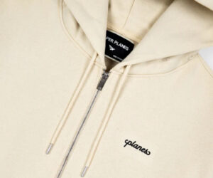 The Scripted Weld Set sweatsuit displayed in black, grey, and tan with zip-up hoodie and crewneck styles