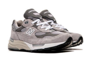 Close-up of the New Balance U992GY Made in USA shoe showcasing premium grey suede, mesh panels, and ABZORB cushioning