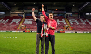 Ryan Reynolds and Rob McElhenney celebrate Wrexham AFC’s historic third promotion, reaching the English Championship in 2025