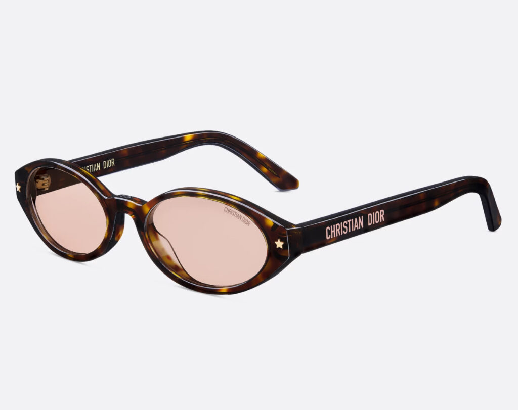 Close-up of DiorPacific R1F oval sunglasses in brown tortoiseshell-effect acetate, featuring minimalist luxury detailing