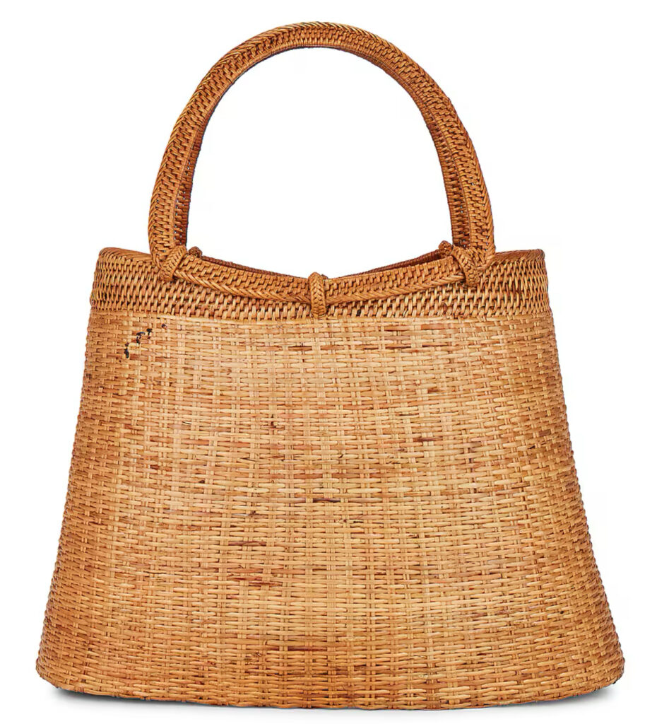 beaded Casa Clara Strawberry Bag with green handle shaped like a fruit stem, styled as a playful summer accessory