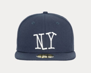 Stüssy x New Era 59FIFTY fitted cap with embroidered logo on front and side, flat brim, black polyester design