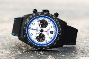 Tudor Black Bay Chrono Carbon 25 watch with carbon fiber case, racing white dial, and blue accents inspired by F1 livery