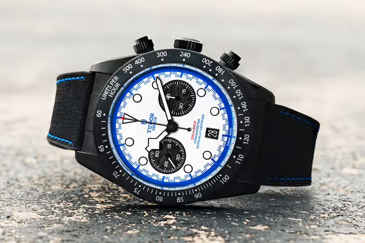 Tudor Black Bay Chrono Carbon 25 watch with carbon fiber case, racing white dial, and blue accents inspired by F1 livery