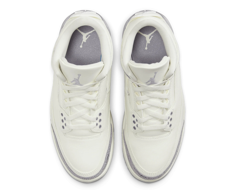 Women’s Air Jordan 3 Retro shoe in Sail, Cement Grey, and Metallic Silver with elephant print and hangtag details