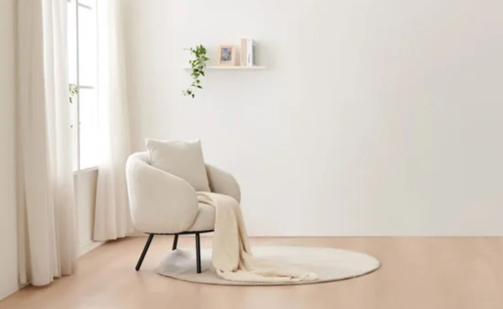 A colorful, layered living room with vintage furniture, books, and eclectic decor replacing minimalist white space