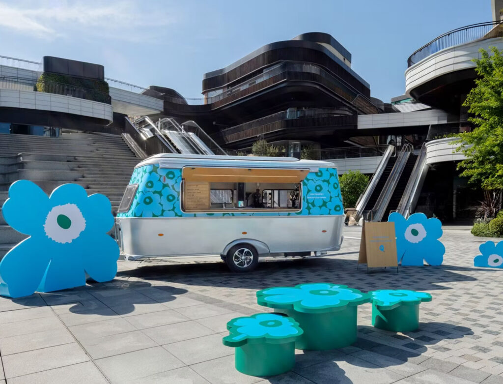 Colorful Marimekko x Blue Bottle Coffee pop-up truck serving customers at Taikoo Li Qiantan, Shanghai, surrounded by modern architecture