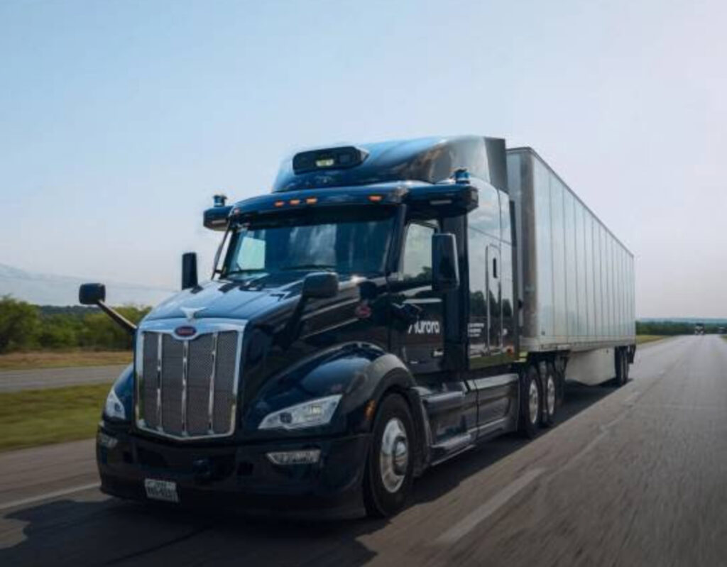Aurora autonomous semi-truck on Texas highway, signaling the start of driverless freight operations between Dallas and Houston