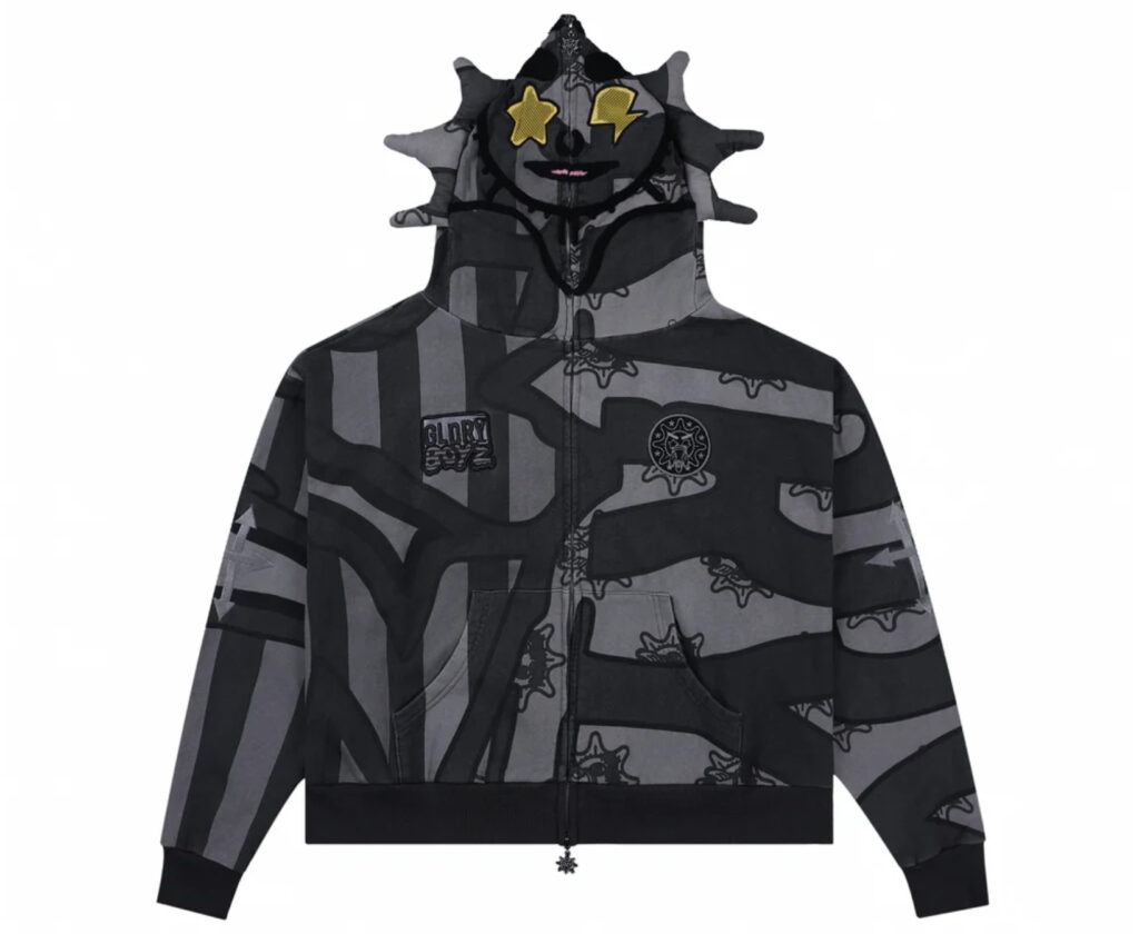Grey GLO GANG hoodie featuring embroidered Glory Boyz flag logo across chest, representing drill culture and streetwear roots