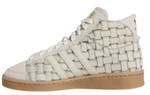 A refined return of the adidas Jabbar Hi in Offwhite/Crew White, honoring basketball legacy and timeless design