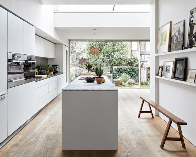 Anne Hathaway’s Manhattan apartment features a minimalist, concealed kitchen with seamless cabinetry and matte finishes
