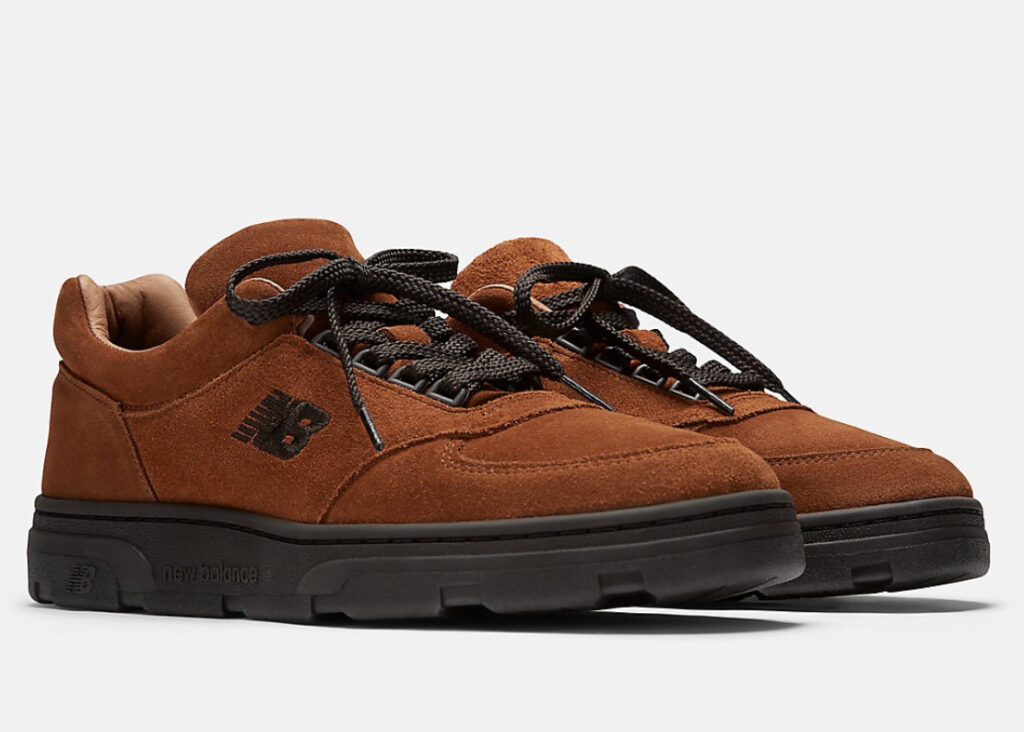 Close-up of the New Balance Made in UK Allerdale Shoe in premium suede and mesh, photographed on a stone-paved path