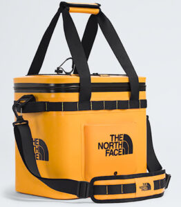 The North Face Base Camp Cooler 15 Qt shown in Summit Gold with lid open, showcasing its compact insulated interior