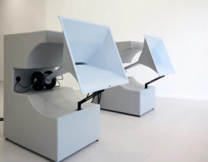 Installation view of Erwan Sene’s Chutes and Signals, featuring sculptural paintings and sewer-inspired art structures