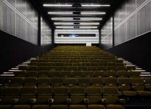Fondazione Prada’s cinema space in Milan showcasing film stills from experimental screenings