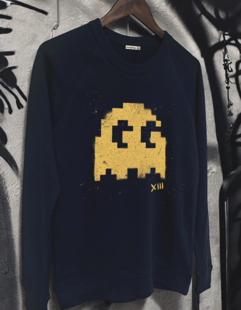 Discarded French Terry garments on rusted racks inside the sun-drenched ruins of Sun City Rags, abandoned pop-up event