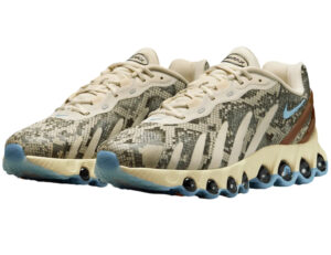 Nike Air Max Dn8 shoe in light khaki with snakeskin texture, viewed from the side against a minimalist background