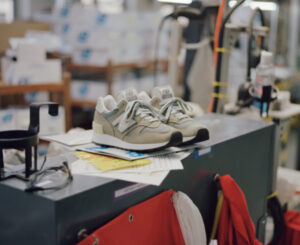 Close-up of the 2025 New Balance Made in USA 1300JP sneaker featuring grey pigskin nubuck and mesh upper, ENCAP midsole, and heritage design details, photographed during Grey Days launch